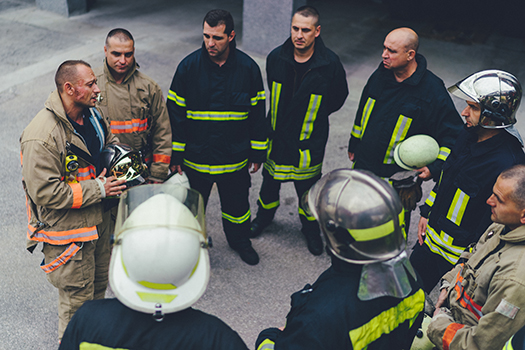 Team of firefighters listening to instructions